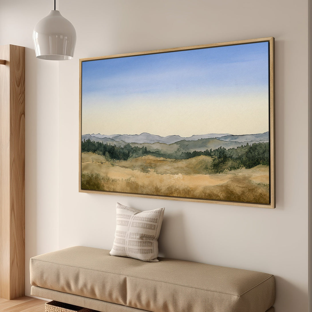 Framed Wall Art featuring a watercolor landscape in muted blues, greens, and golds. Perfect for adding a touch of nature and tranquility to your home.