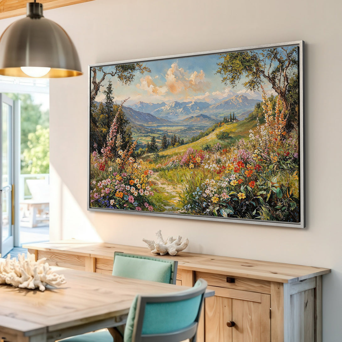 Framed Wall Art featuring a vibrant landscape painting with a colorful floral foreground and mountain backdrop. Warm, inviting color palette.