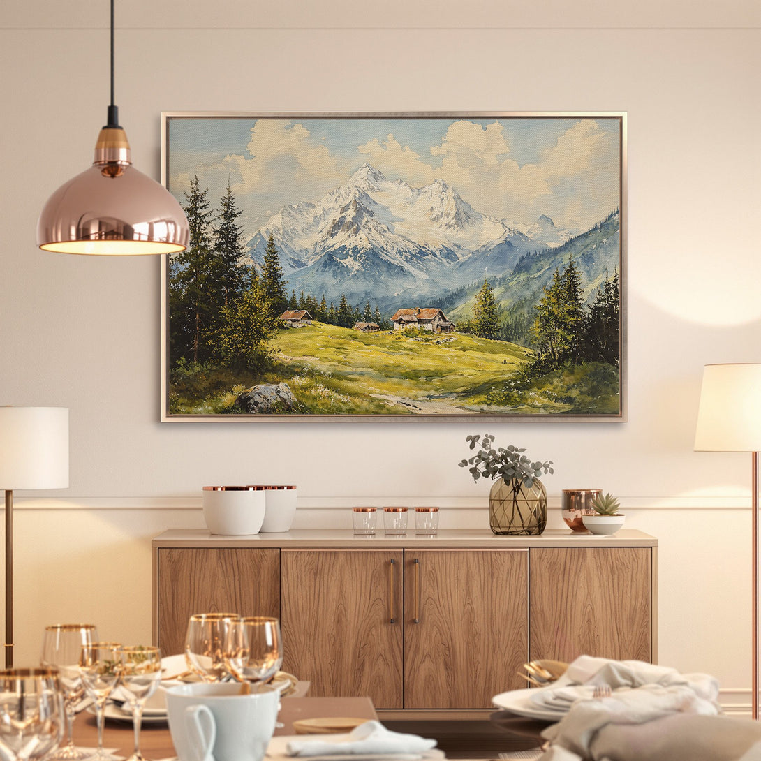 Framed Wall Art: Watercolor mountain landscape in a dining room. Featuring a serene, natural scene with blue, green, and beige tones. Perfect for home decor.