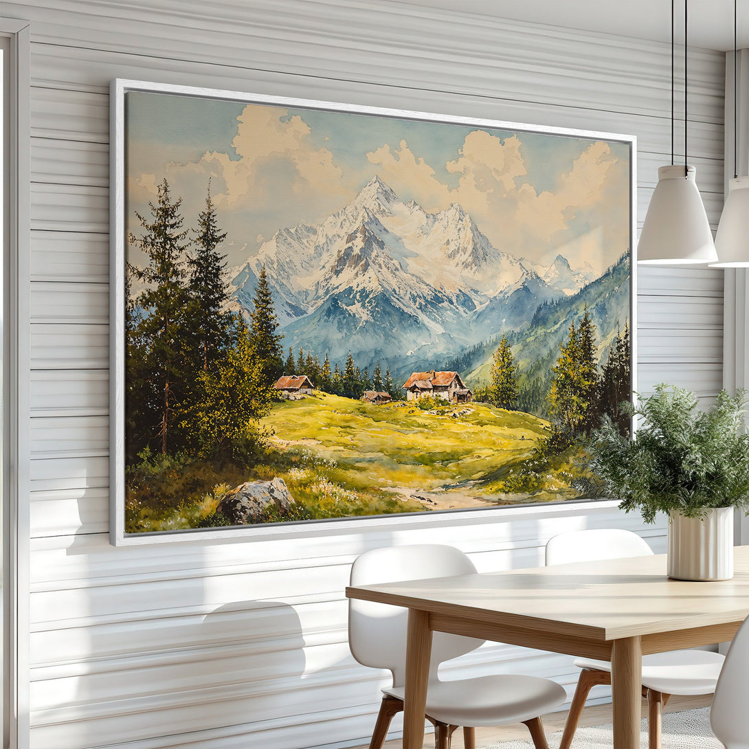 Framed Wall Art: Watercolor mountain landscape in a dining room. Earthy tones of green, blue, and yellow create a serene, artistic vibe.