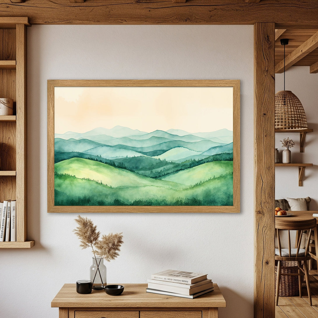 Framed Poster featuring a watercolor landscape of rolling green hills and mountains. Serene art for your home, with a calming green and blue palette.