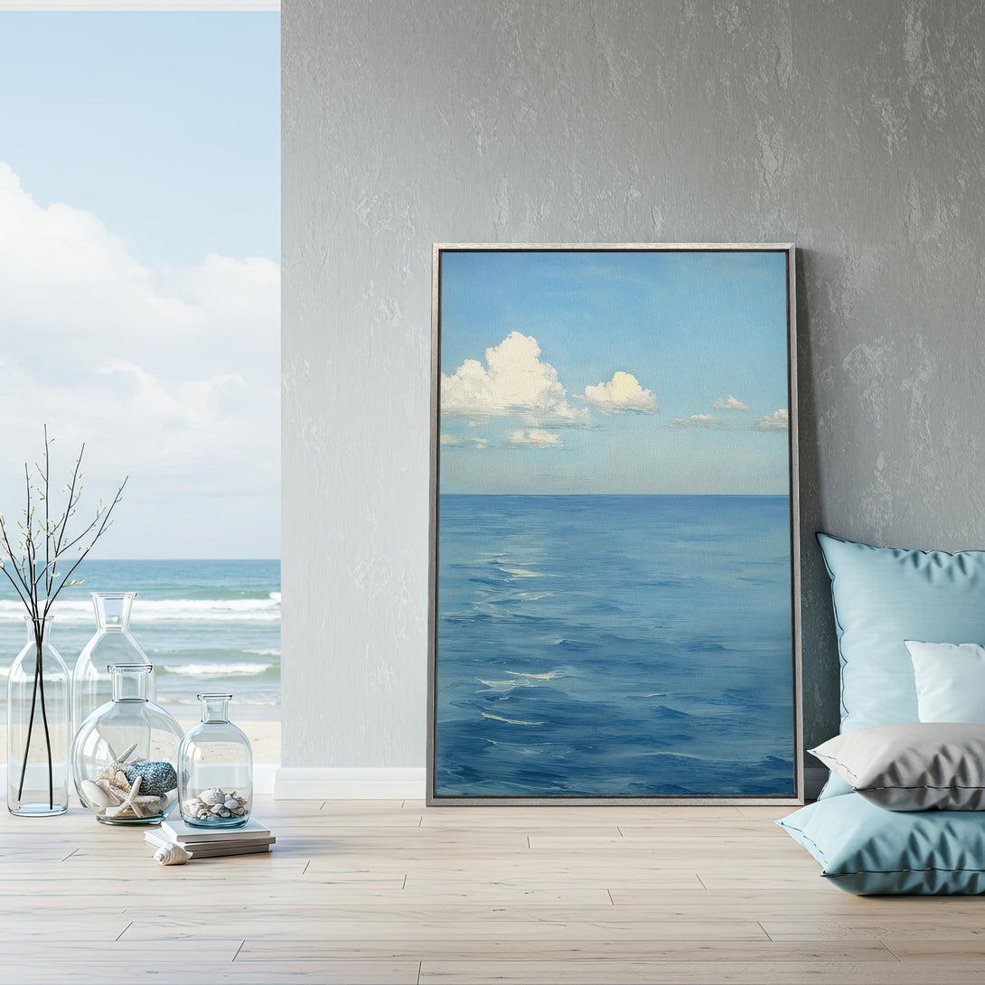 Framed Wall Art: Serene ocean landscape painting in calming blue hues. Coastal decor inspiration for a tranquil living space.