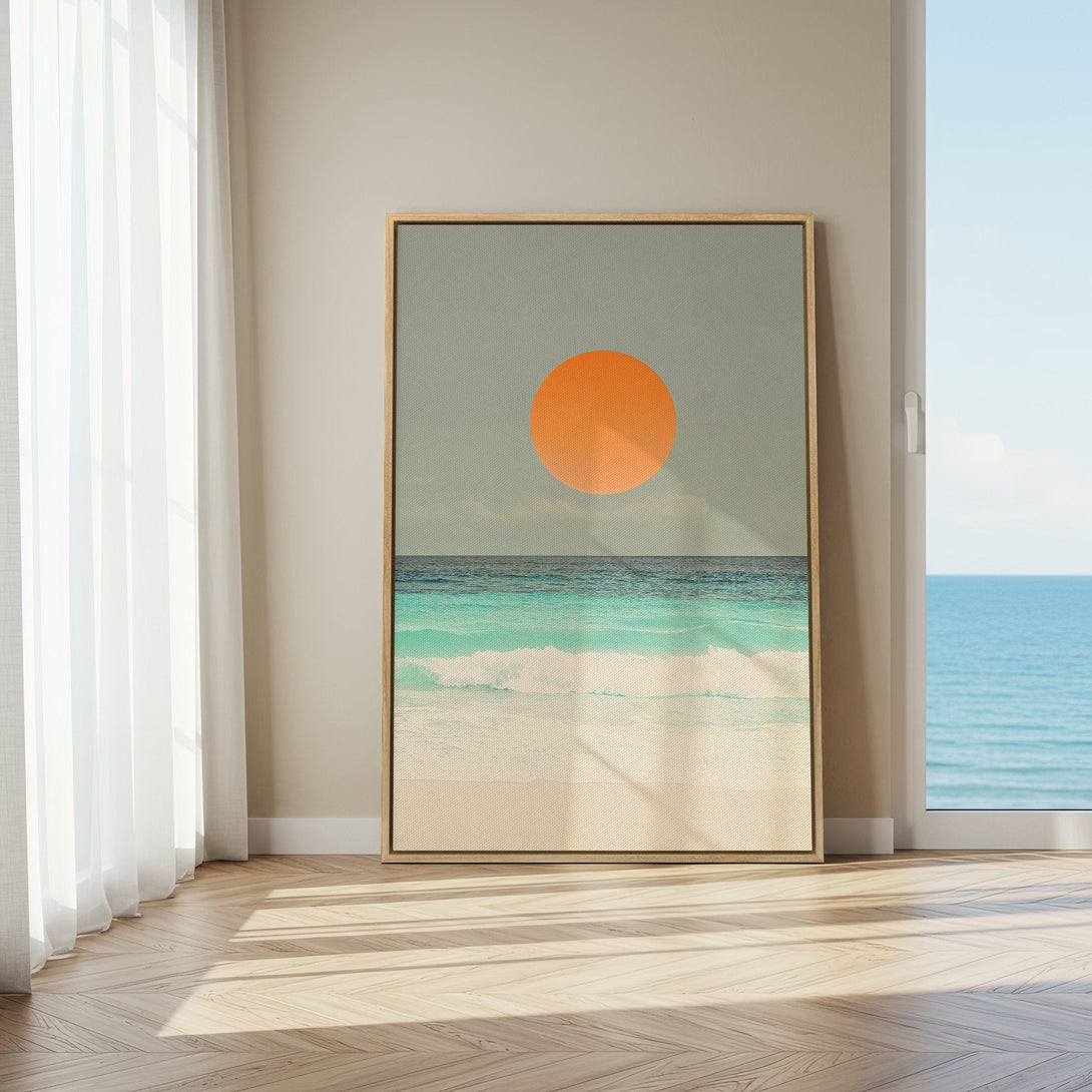 Framed Wall Art: Coastal sunset canvas print in a modern interior. Featuring ocean waves in turquoise & teal, with a warm orange sun. Perfect beach decor!