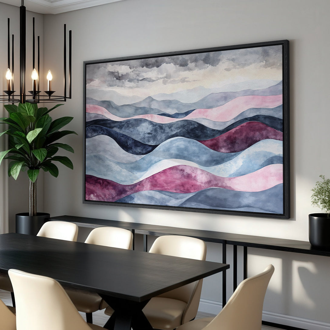 Framed Wall Art featuring abstract watercolor mountains in a modern interior. The Canvas Print showcases a calming palette of blues, pinks, and grays.
