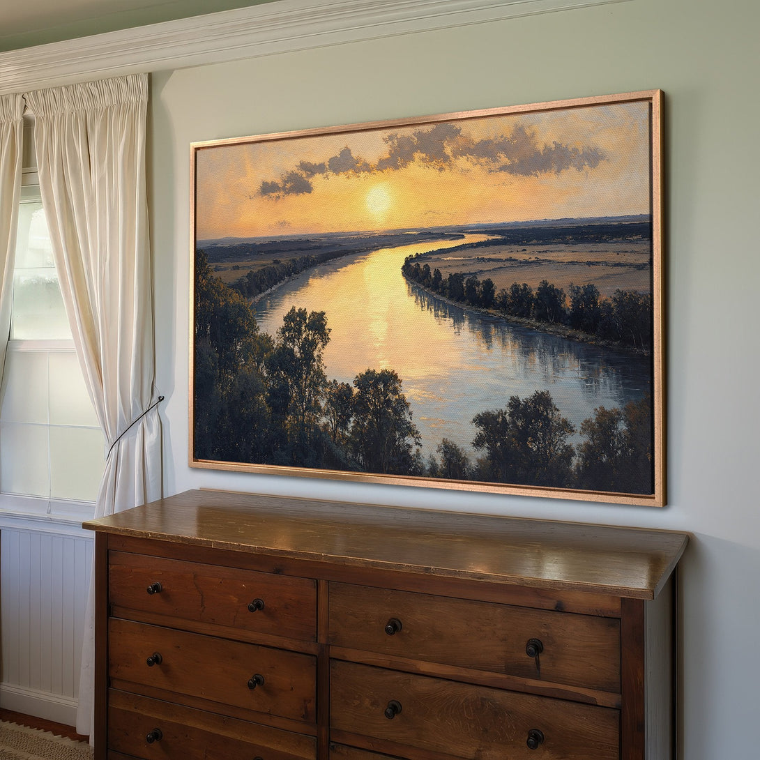 Framed Wall Art featuring a landscape painting of a river at sunset. Warm, golden color palette with a classic, traditional style. Perfect for home decor.
