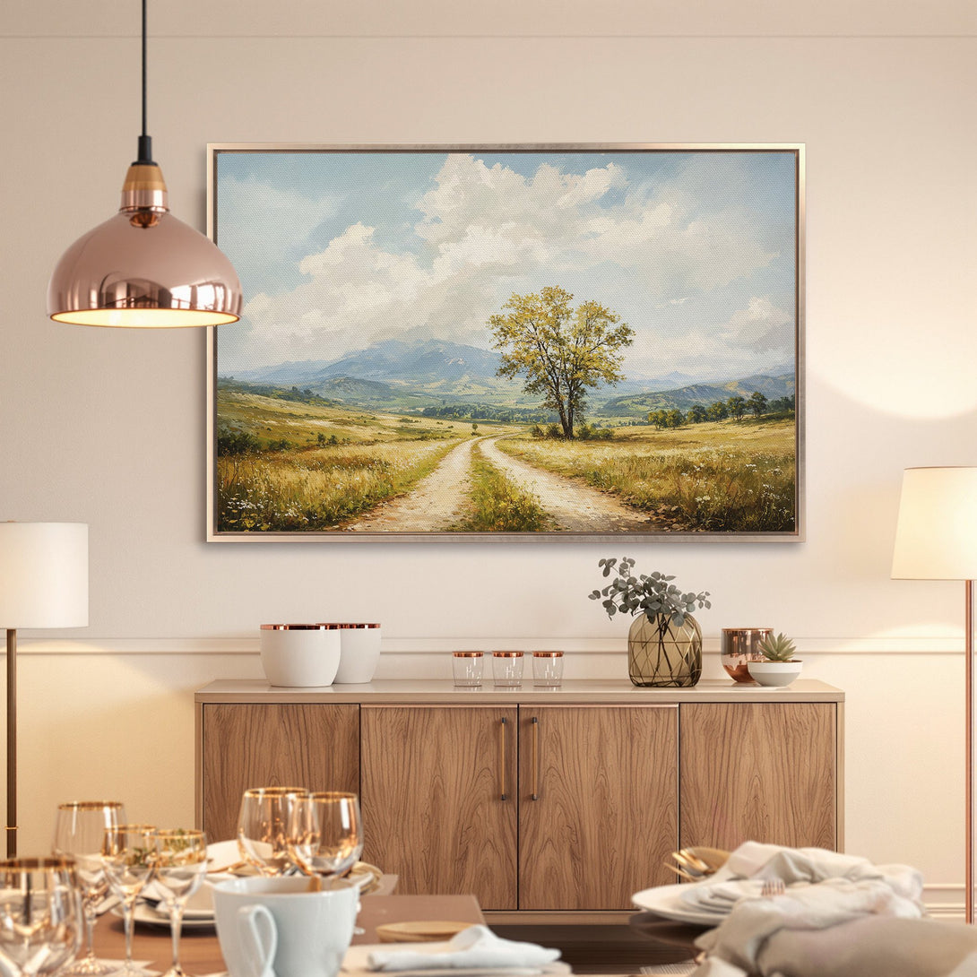 Framed Wall Art of a landscape painting with a dirt road and tree, warm yellow and blue tones, perfect for home decor.