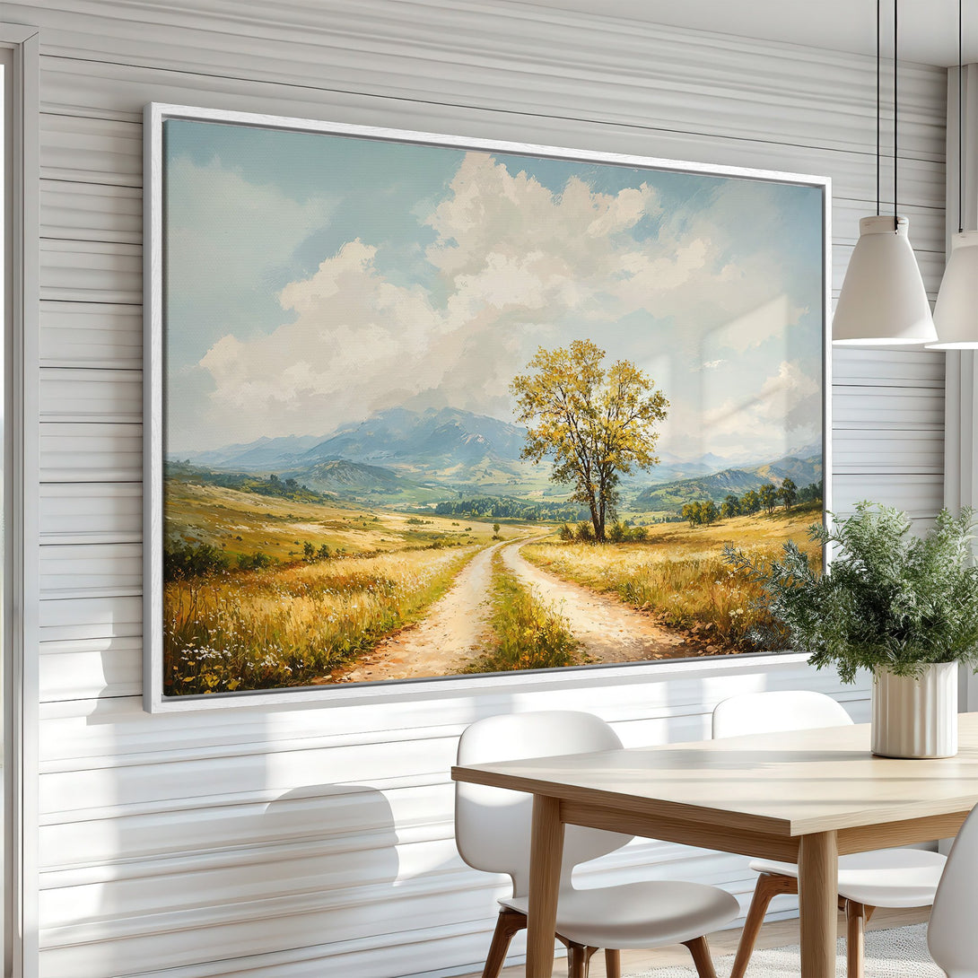Framed Wall Art: Landscape Canvas Print with a dirt road, tree, and mountains. Warm, earthy tones of yellow, green, and blue create a serene, inviting scene.