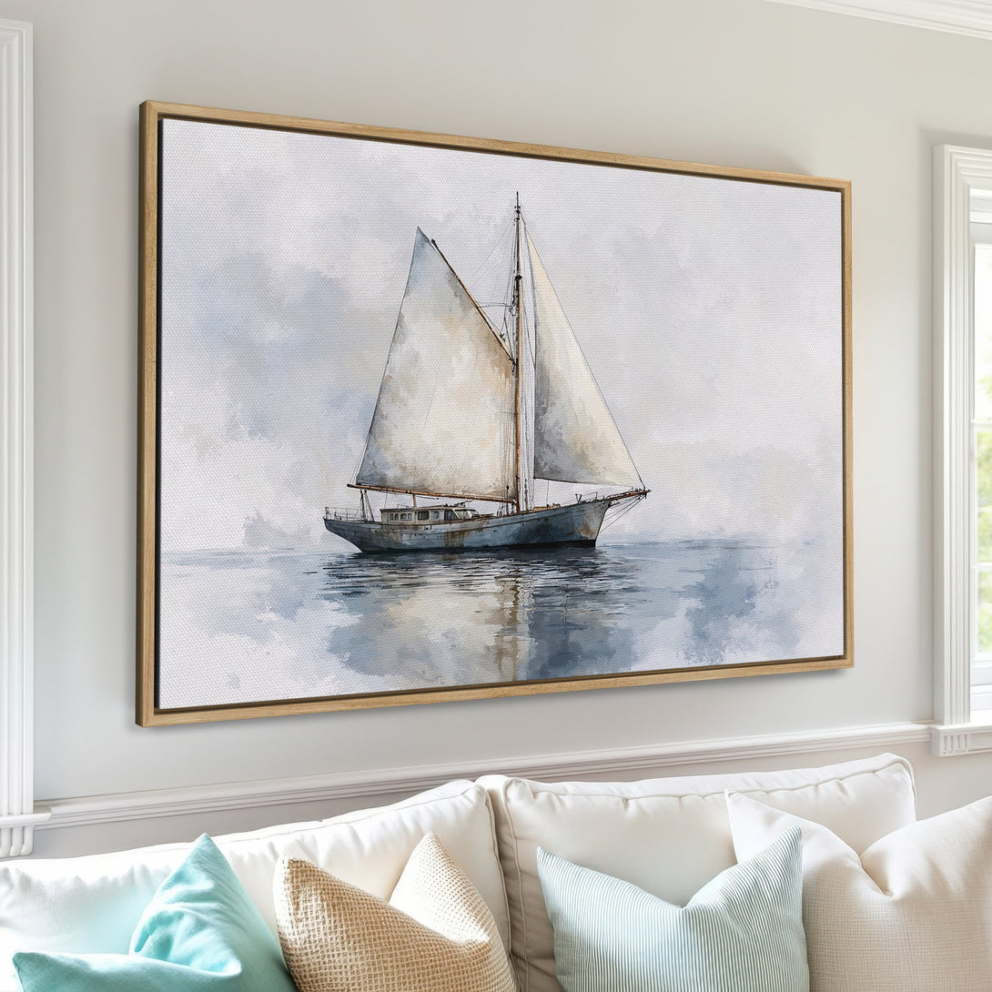 Framed Wall Art: Watercolor sailboat print in serene blue and neutral tones. Coastal art for a calming living room.