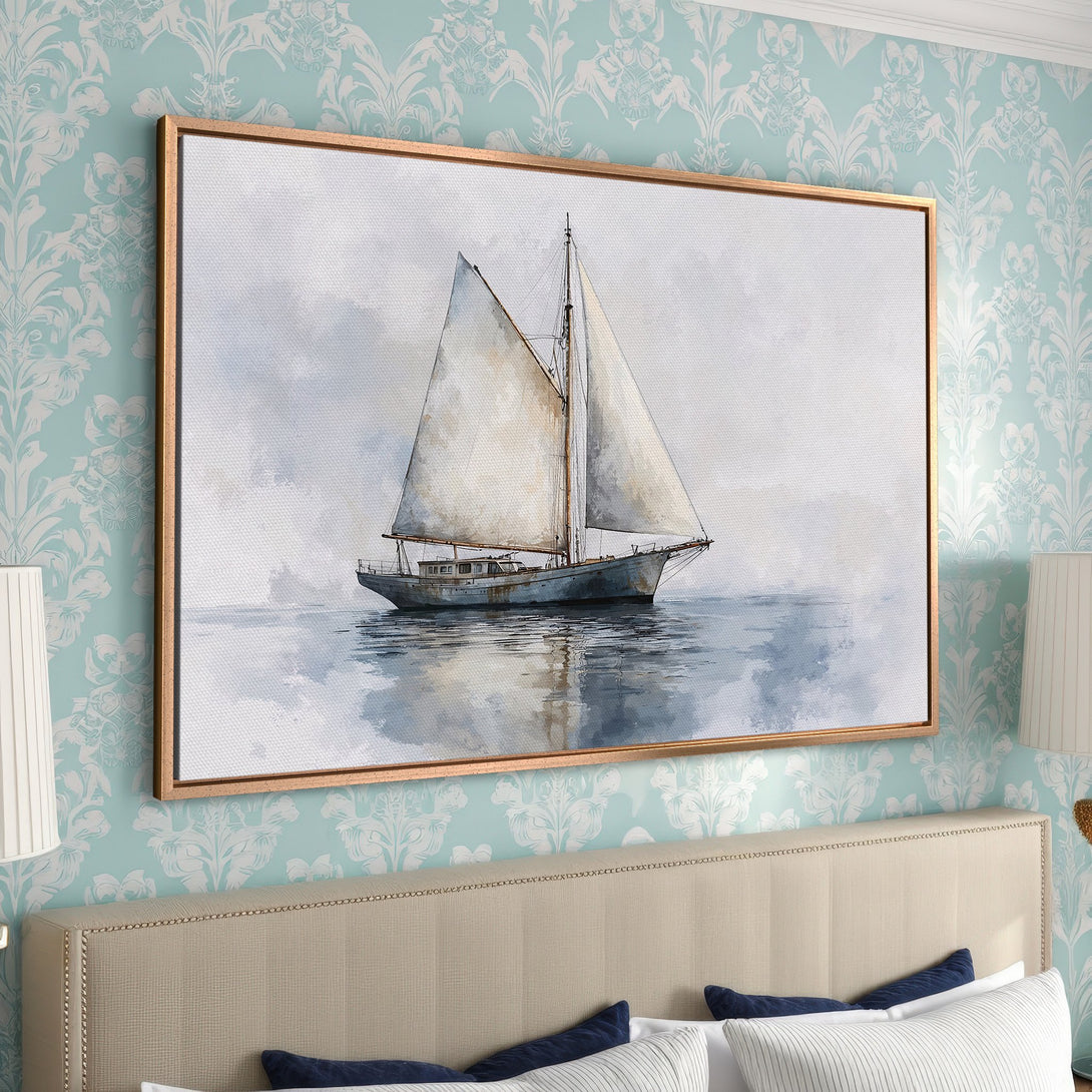 Framed Wall Art: Serene sailboat canvas print in muted blue & gray tones. Coastal art perfect for bedroom decor. Shop now for calming wall art!