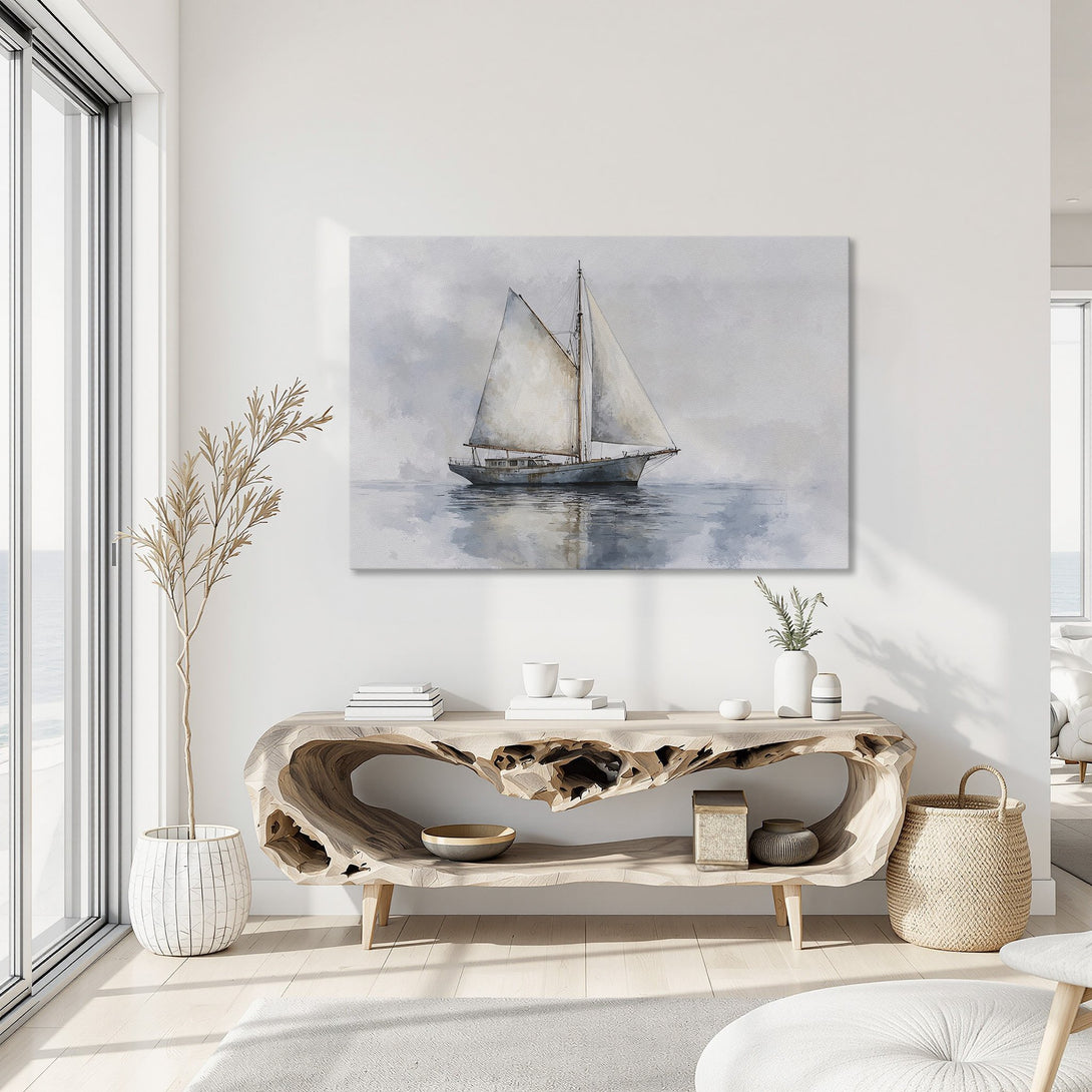 Framed Wall Art featuring a sailboat painting in a coastal style with a serene blue and neutral color palette. Perfect for any home!