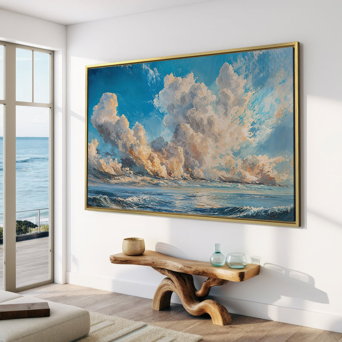 Canvas Print of a seascape with dramatic clouds in a coastal living room. Featuring blue, white, and gold hues. Bring the ocean home!