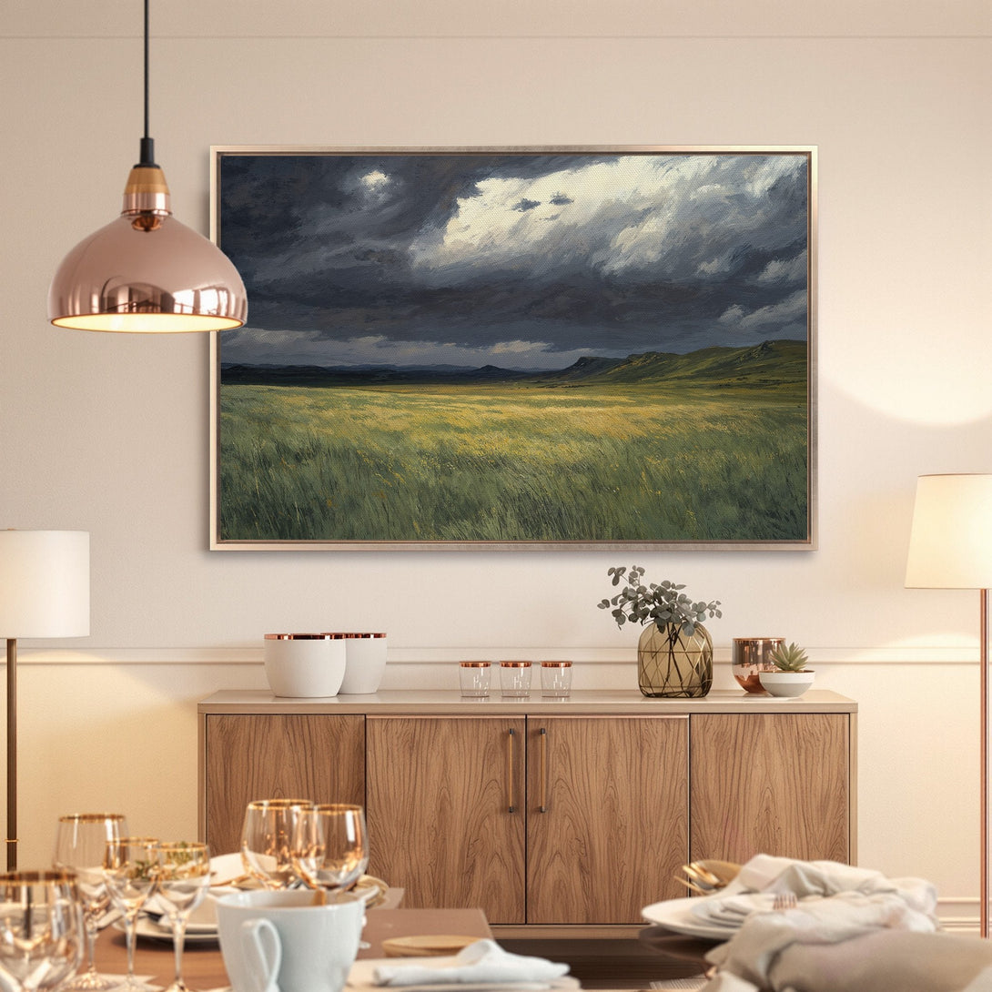 Framed Wall Art: Dramatic landscape Canvas Print with a moody sky and green field. Earthy tones create a serene, modern aesthetic.