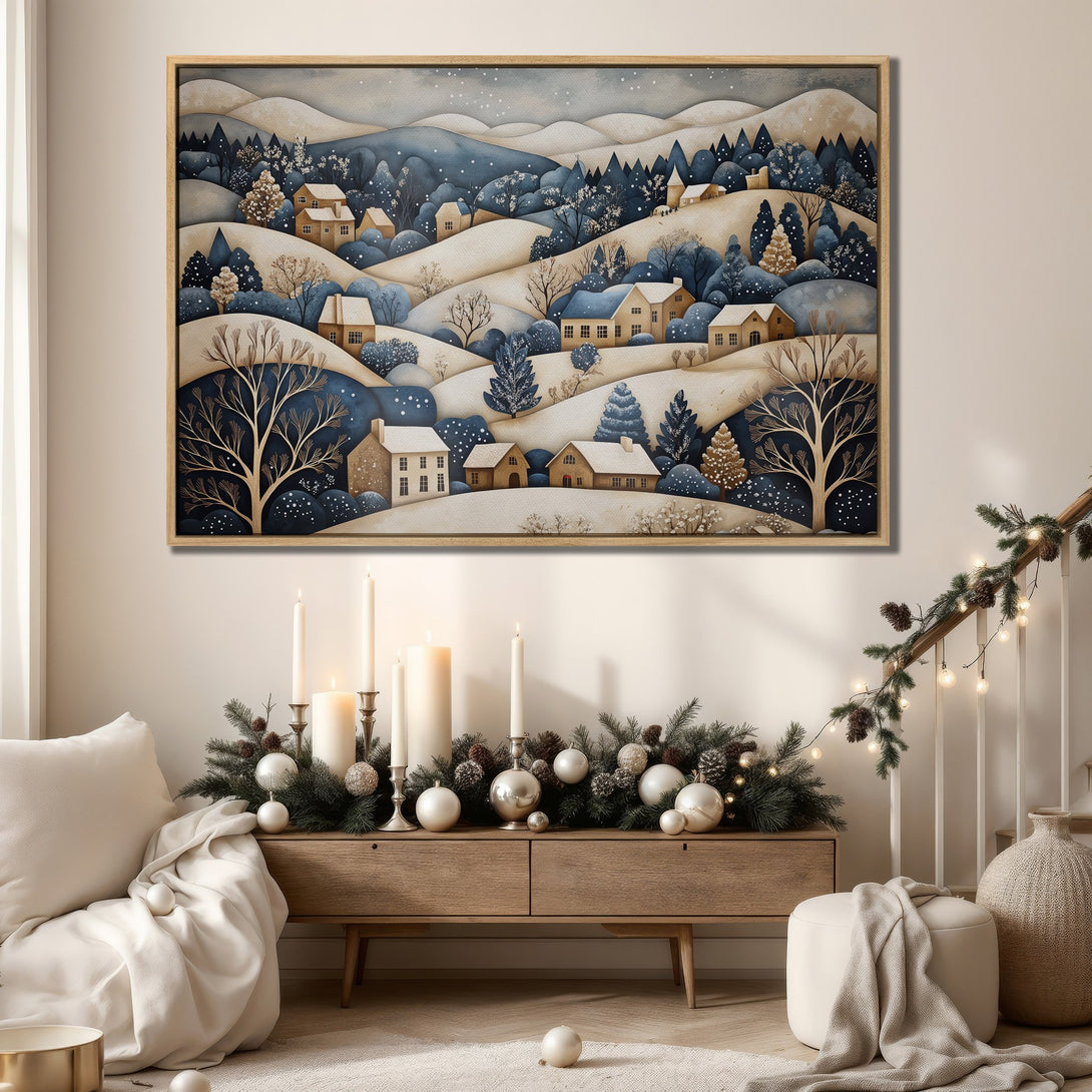 Framed Wall Art: Winter landscape canvas print in a cozy interior. Features a whimsical village scene with a blue, beige, and gold color palette. Perfect for holiday decor.