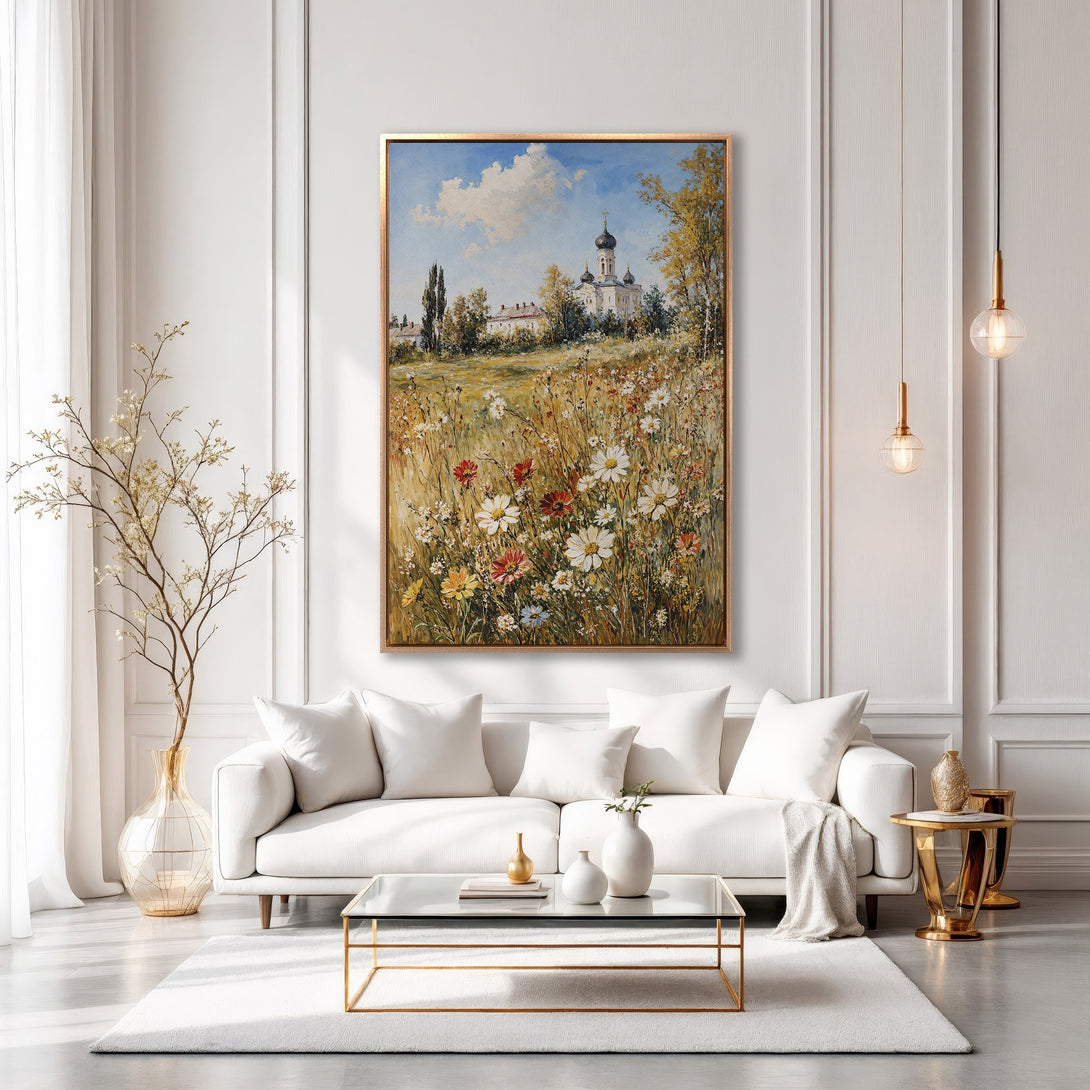 Framed Wall Art: Landscape painting of a church in a field of flowers. Warm color palette, displayed in a modern, elegant living room setting.