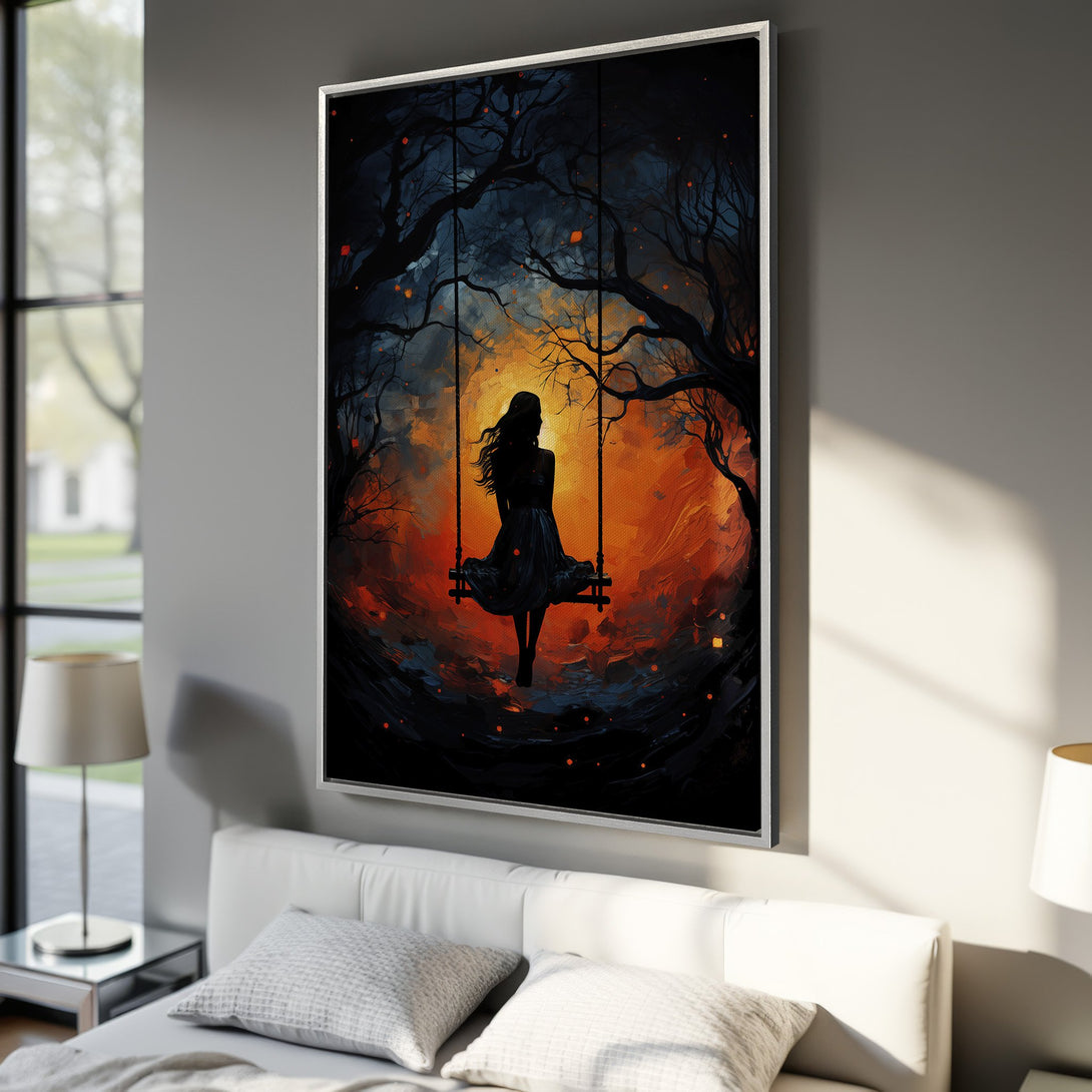 Framed Wall Art: Silhouette of woman on swing in a vibrant orange and blue landscape. Artistic, moody style, perfect for bedroom decor.