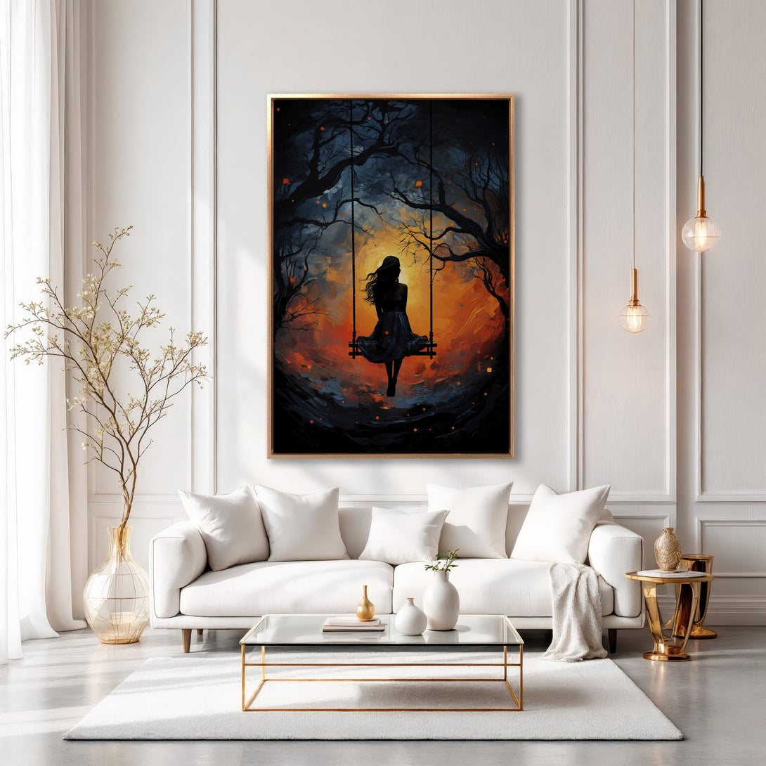 Framed Wall Art: Silhouette of a woman on a swing in a vibrant sunset scene. Dramatic art with a warm orange and blue color palette. Perfect home decor.
