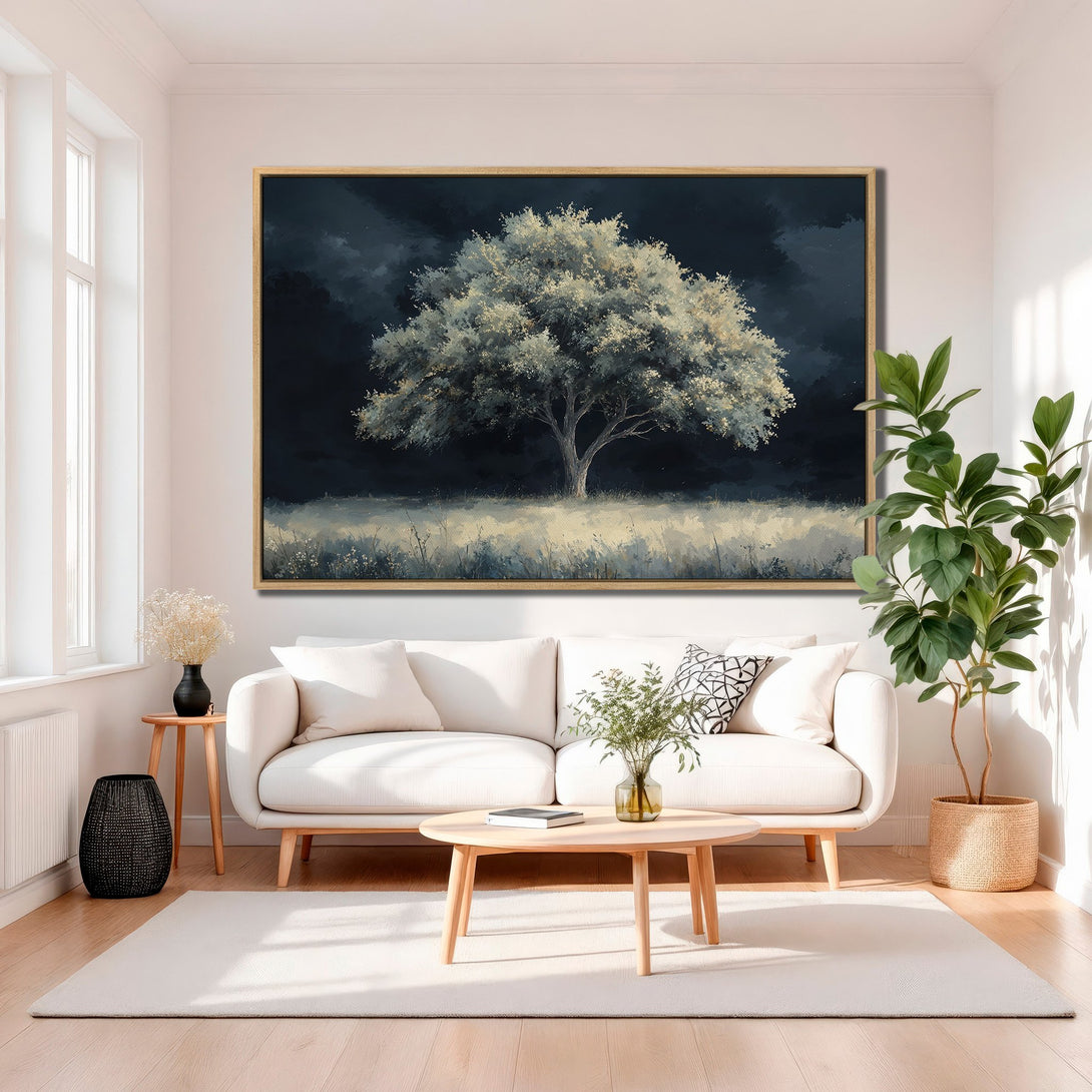 Framed Wall Art: Majestic tree painting in a modern living room. Dark blue and white color palette creates a serene, artistic atmosphere. Perfect home decor.
