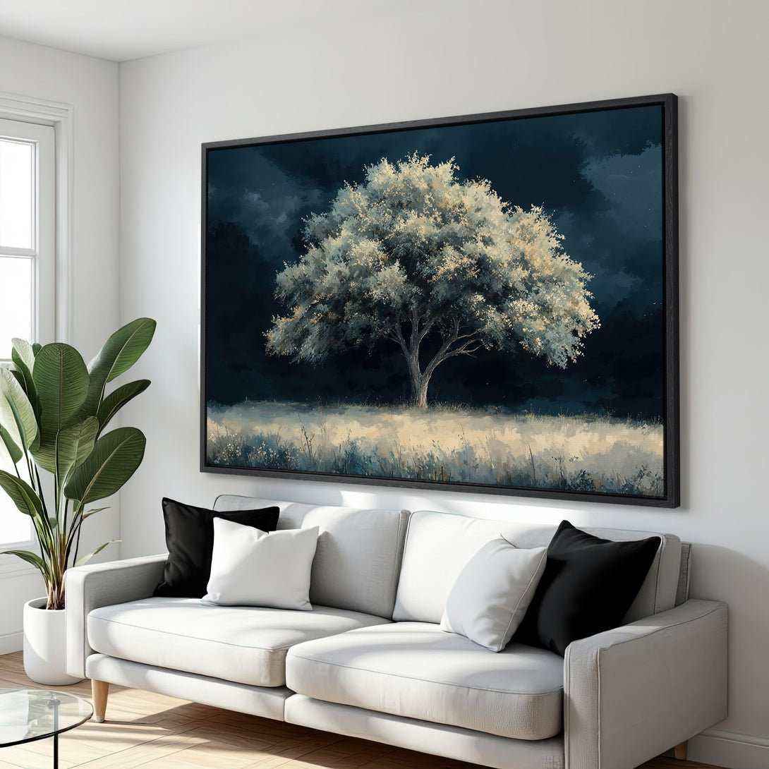 Framed Wall Art: Majestic tree painting in a moody blue and white palette. Enhance your living room with this stunning canvas print.
