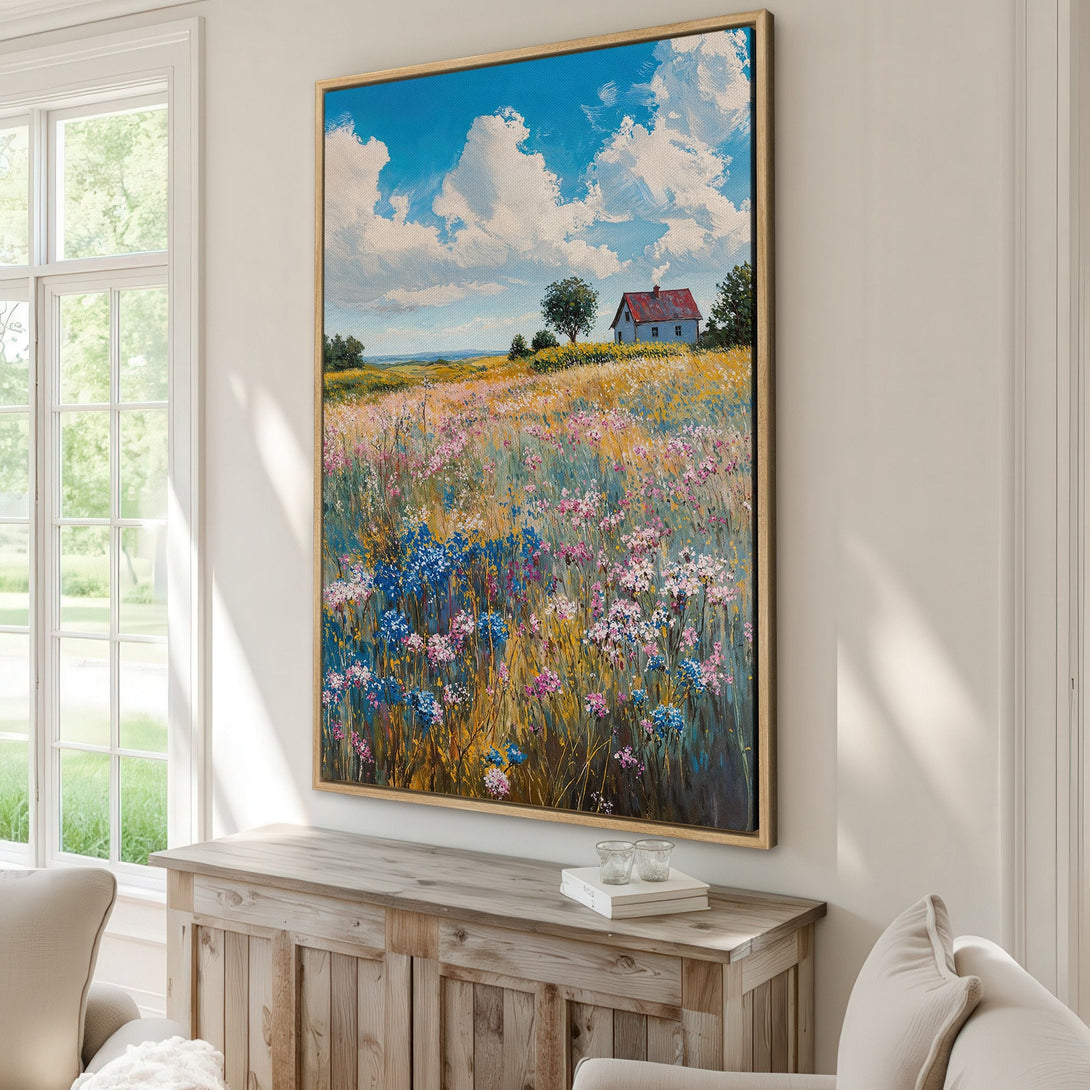 Framed Wall Art: Impressionist landscape painting of a field with wildflowers, a blue sky, and a house. Beautiful color palette of blues, pinks, yellows, and greens.