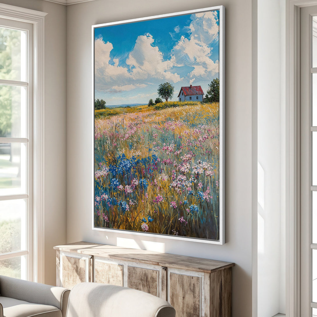 Framed Wall Art: Impressionist landscape Canvas Print with a vibrant field of wildflowers, a blue sky, and a charming red-roofed cottage. Adds a pop of color!