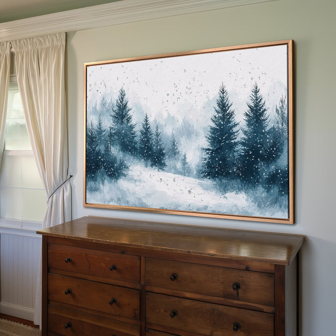 Framed Wall Art featuring a serene winter forest scene in a blue and white watercolor style. Perfect for adding a touch of nature to your home decor.