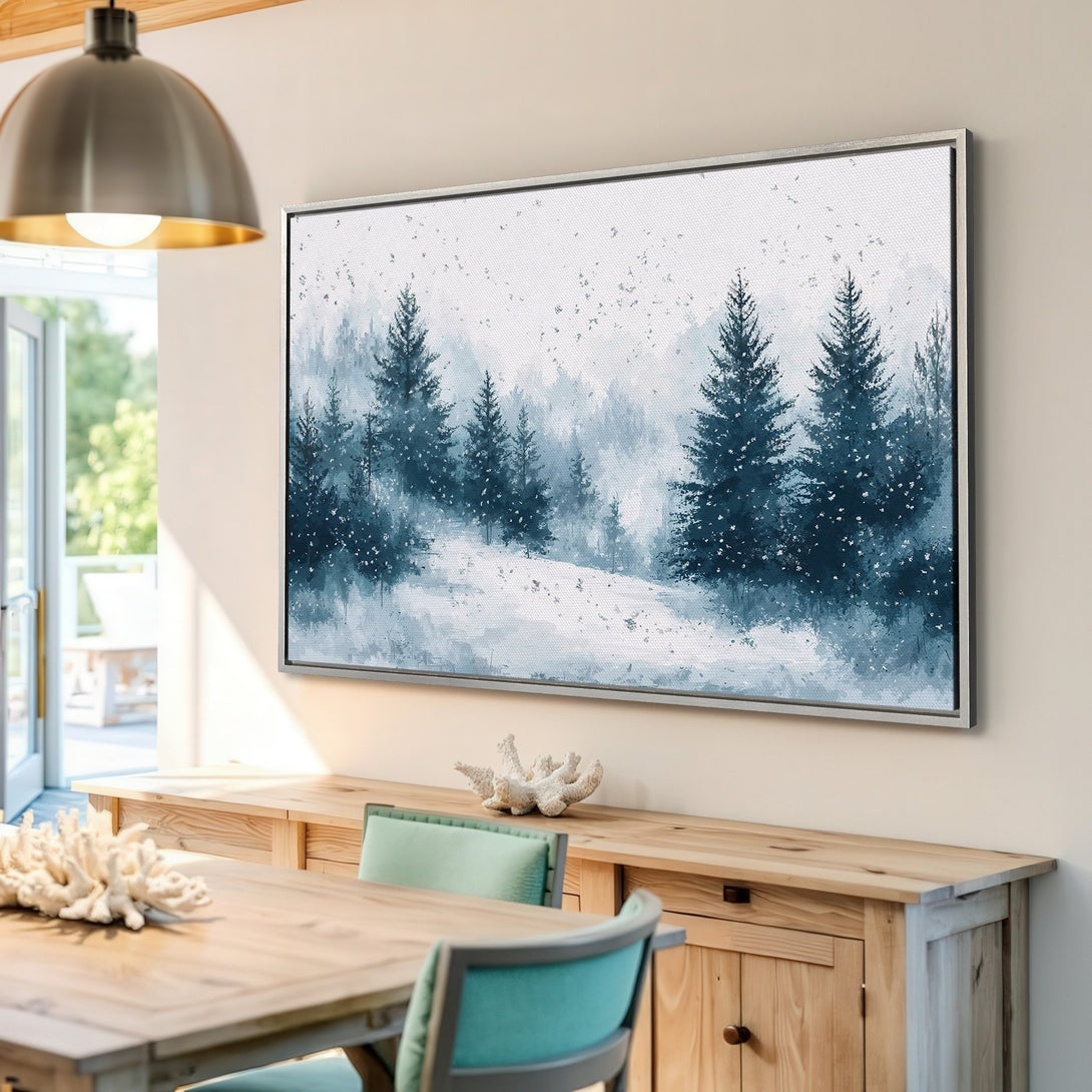 Framed Wall Art featuring a serene winter forest scene in a watercolor style. Blue and white color palette adds a calming touch to any space.