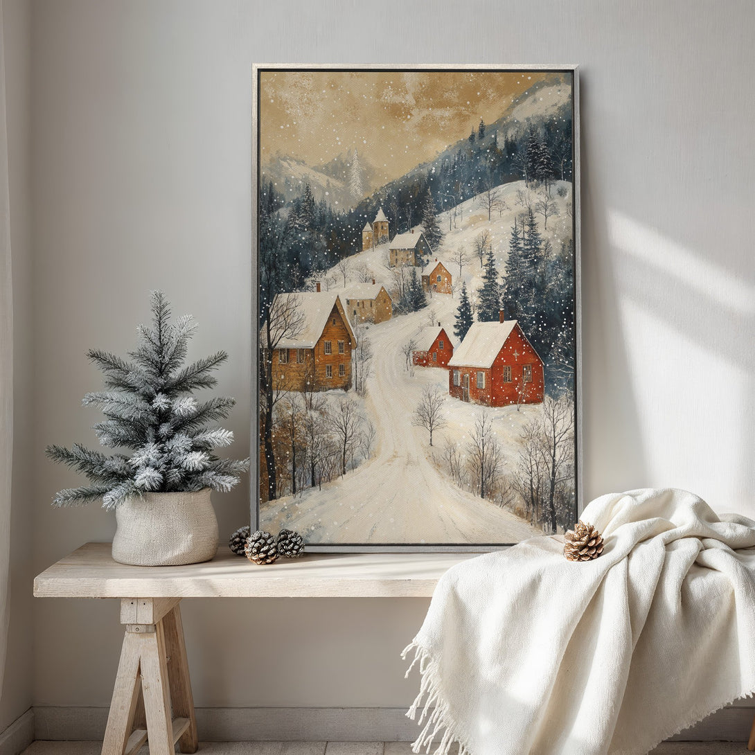 Framed Wall Art featuring a winter village scene in a watercolor style with a warm, snowy color palette. Perfect for cozy home decor.