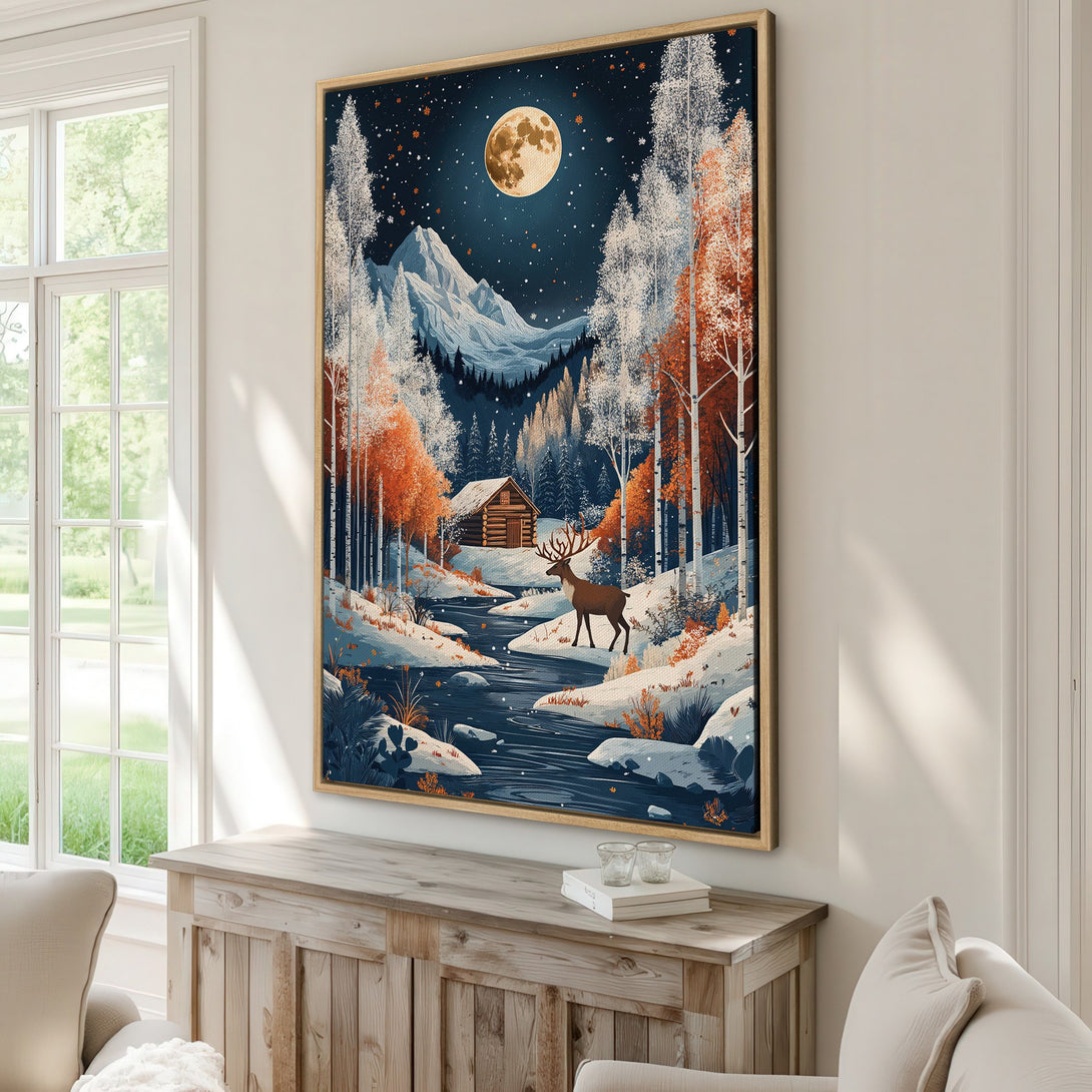 Framed Wall Art: Winter landscape Canvas Print with a cabin, deer, and moon. Features a blue, orange, and white color palette, perfect for cozy home decor.