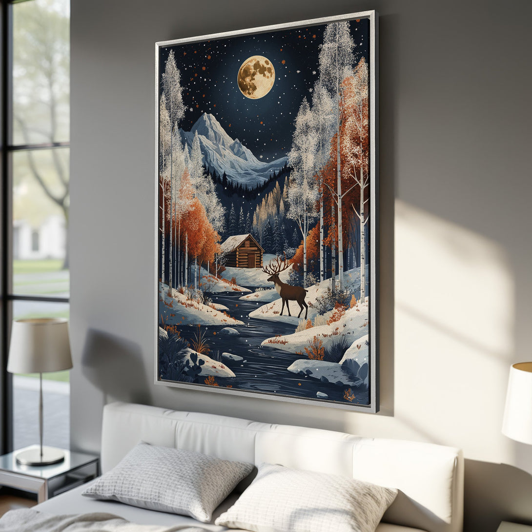 Framed Wall Art: Majestic winter landscape with a deer, cabin, and moon. Featuring a cool blue, white, and orange palette, perfect for home decor.
