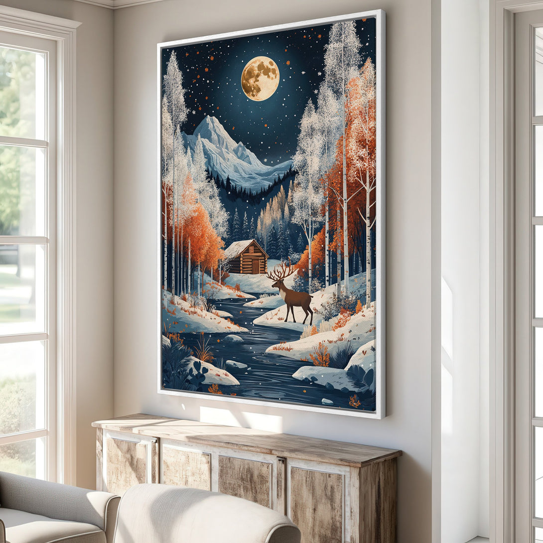 Framed Wall Art: Winter landscape Canvas Print with a cabin, deer, and moon. Features a blue, white, and orange color palette. Perfect for cozy decor.