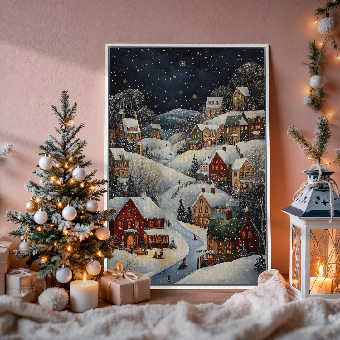Framed Wall Art of a snowy village scene. Cozy winter art with a warm, inviting color palette. Perfect for adding holiday cheer to your home.