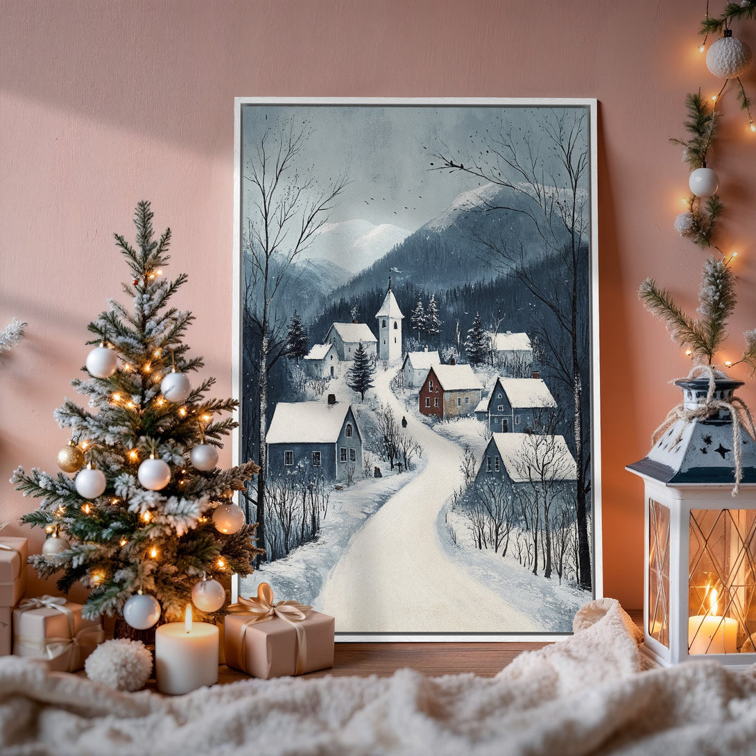 Framed Wall Art: Winter village scene in cool blues and whites. Cozy holiday decor, perfect for adding a touch of winter charm to your home.