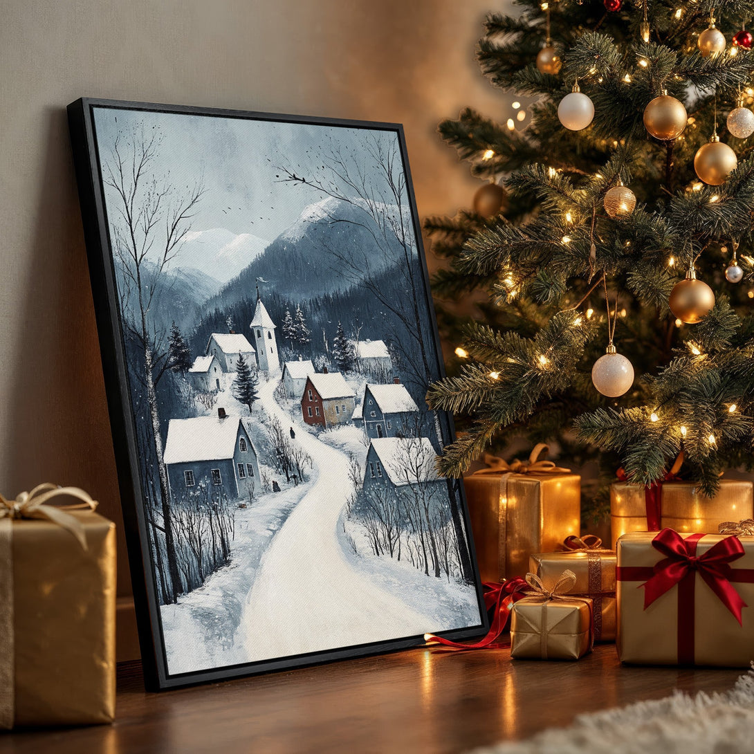Framed Wall Art featuring a winter village scene in a muted blue and white palette. Perfect for adding a touch of cozy charm to your home this holiday season.