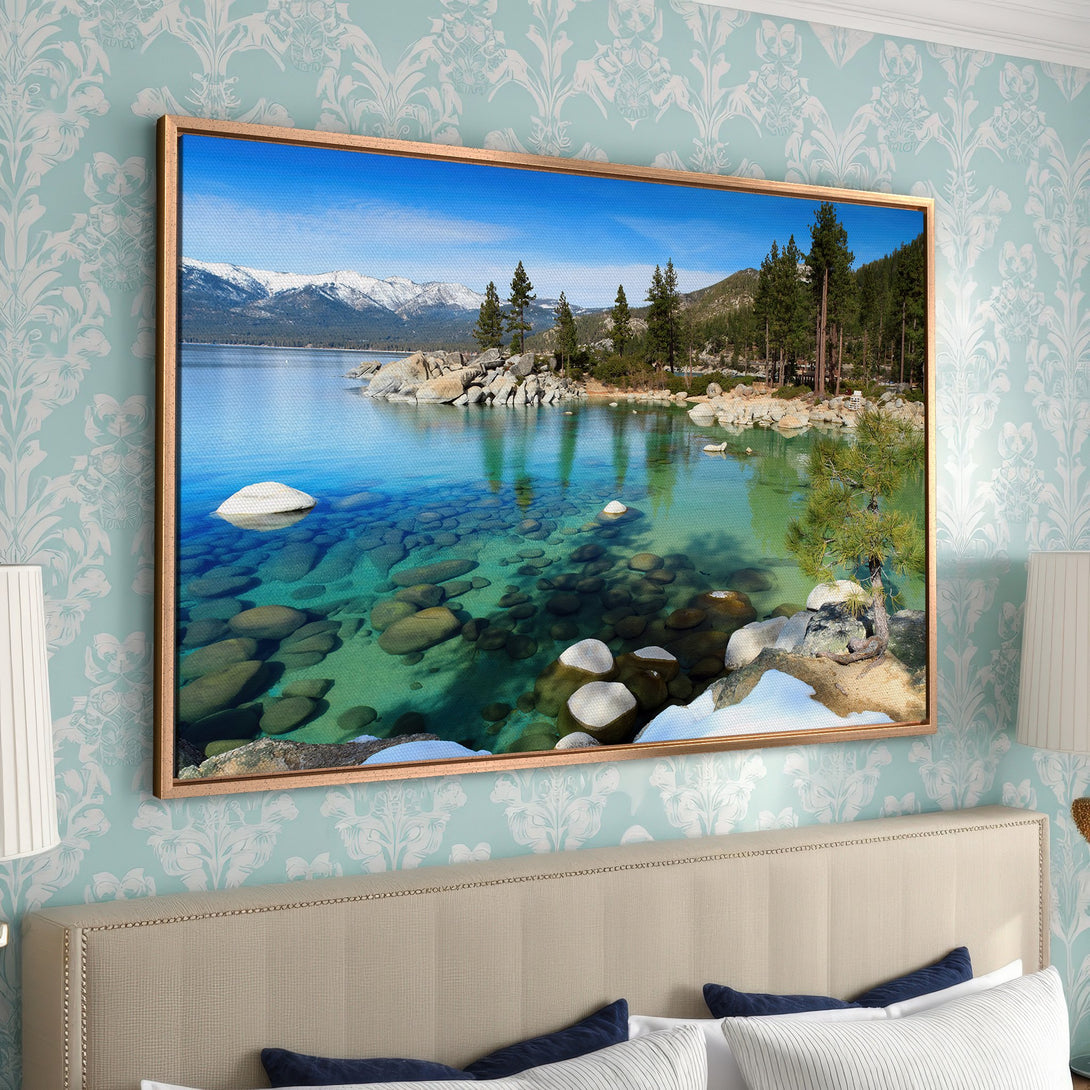 Framed Wall Art: Stunning landscape Canvas Print of a clear lake with mountains, trees, and rocks. Featuring a serene, blue and green color palette.