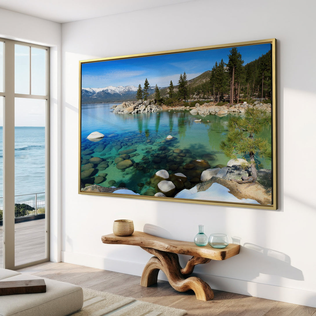 Canvas Print of a serene lake scene with mountains, featuring blue, green, and white hues, displayed in a modern interior.