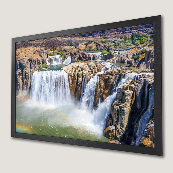 Framed Poster of a majestic waterfall scene with a rainbow. Earthy tones of brown, blue, and green. Bring nature's beauty home!