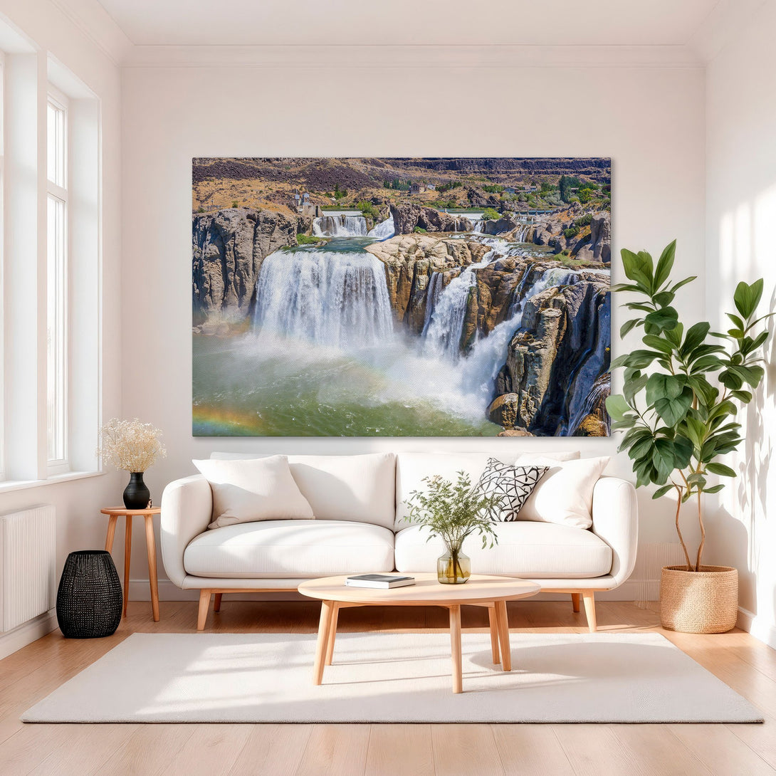 Framed Wall Art of a majestic waterfall with a rainbow. Earthy tones of brown, green, and blue create a stunning landscape. Perfect for adding nature's beauty to your home.