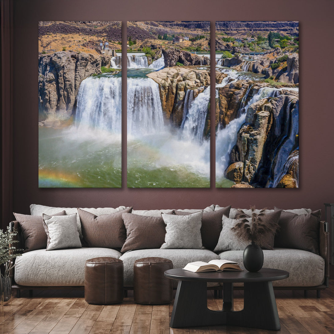 Canvas Print of a majestic waterfall with a rainbow. Earthy tones and vibrant water create a stunning landscape for your home decor.