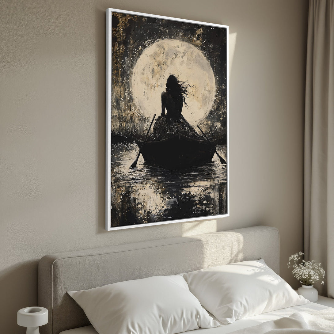 Framed Wall Art: Silhouette of woman in boat under moon, abstract style, black & gold palette. Perfect for bedroom decor. Shop now!