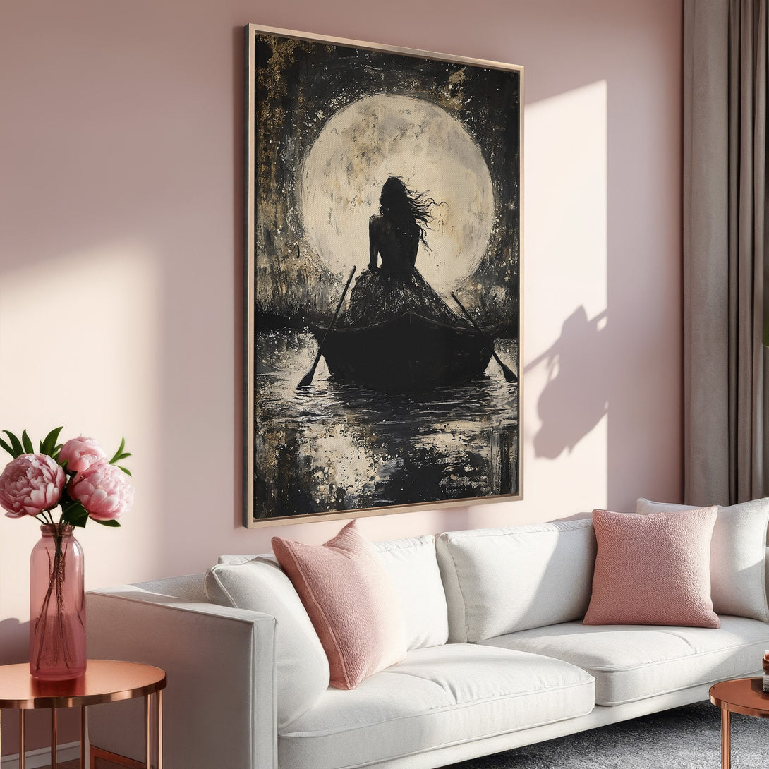 Framed Wall Art: Abstract woman in a boat under a moon. Black, gold, and neutral tones. Perfect for adding a touch of art to your home decor.