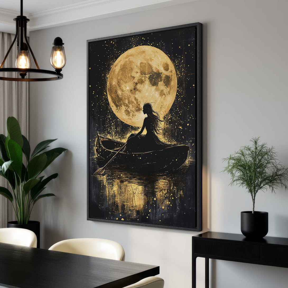 Framed Wall Art: Silhouette of woman in boat under a golden moon. Dramatic art print in black and gold, perfect for adding a touch of elegance.