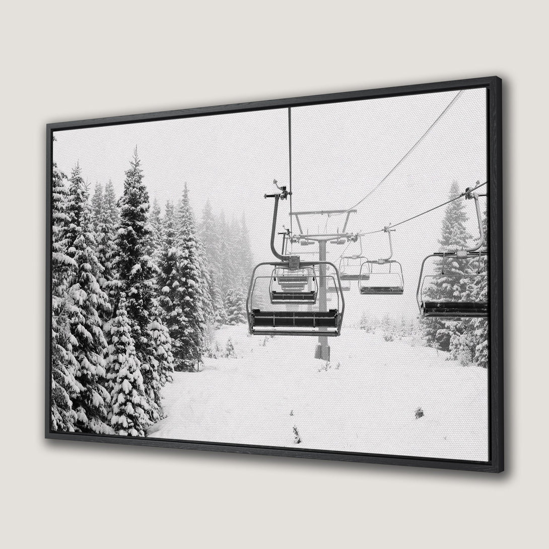 Framed Wall Art: Black & white winter ski lift scene. Modern canvas art featuring snowy trees and chairlifts. Perfect for a cozy cabin aesthetic.