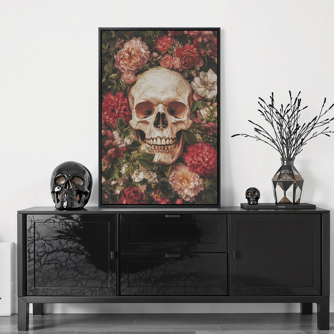 Framed Wall Art featuring a skull surrounded by flowers, in a dark, moody style with red, pink, and green tones. Perfect for gothic decor.