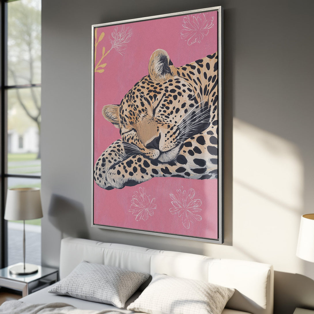 Framed Wall Art: Sleeping leopard canvas print in pink & neutral tones. Modern animal art for bedroom decor. Shop stylish wall art today!