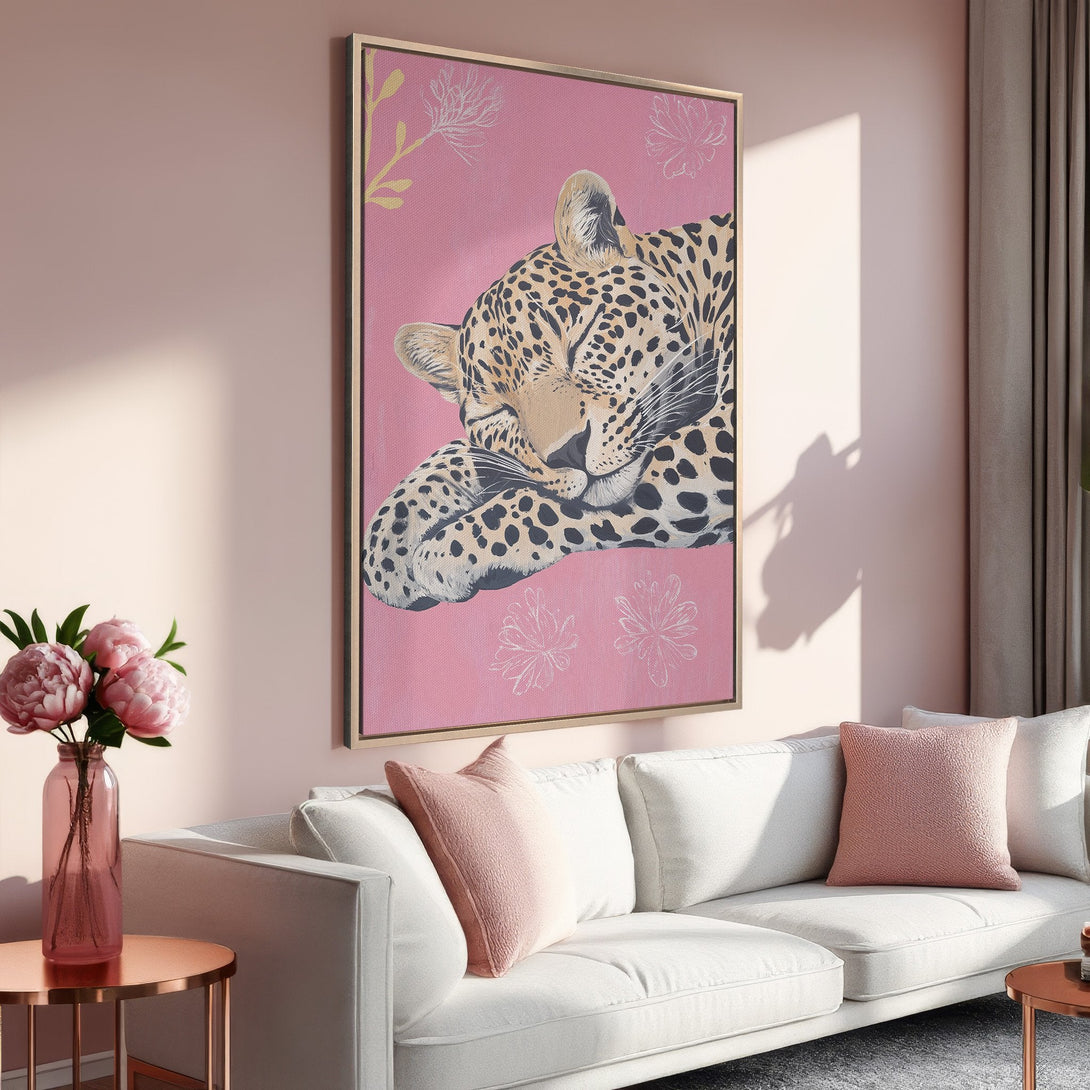 Framed Wall Art: Sleeping leopard print on pink canvas, perfect for modern home decor. Features a blush color palette, adding a touch of elegance.
