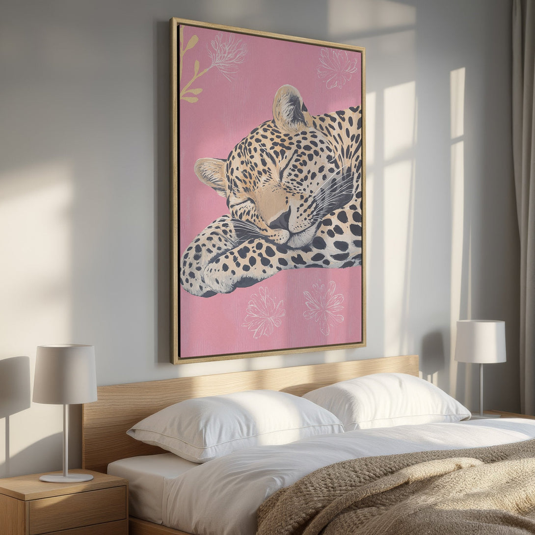 Framed Wall Art: Sleeping leopard print on pink background. Modern, stylish canvas art with warm color palette. Perfect for bedroom decor.