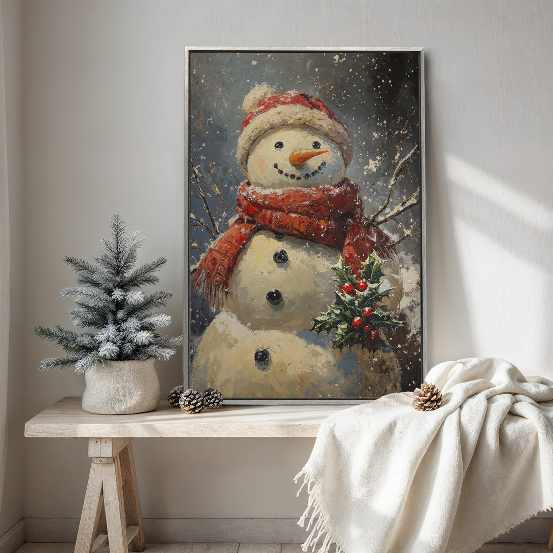 Framed Wall Art: Whimsical snowman painting with a cozy red scarf and hat, set against a snowy, blue-grey background. Perfect for holiday decor!