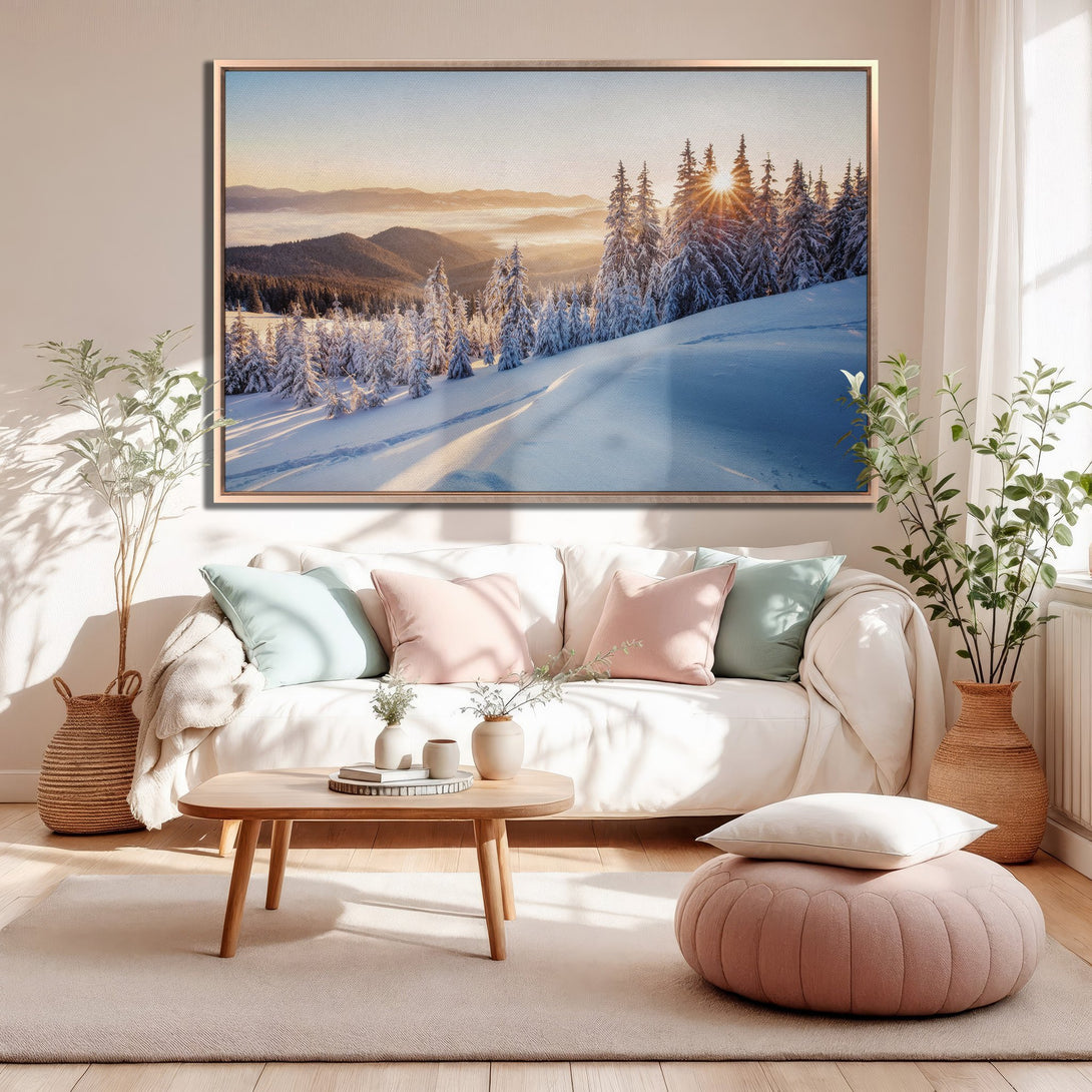 Framed Wall Art: Stunning winter landscape Canvas Print with snowy mountains and trees, warm sunset hues, and a cozy, inviting interior setting.