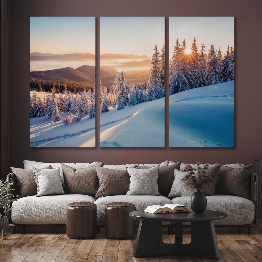 Canvas Print of a winter mountain landscape with snow-covered trees, warm sunset light, and a cool blue and orange color palette. Perfect for living room decor.