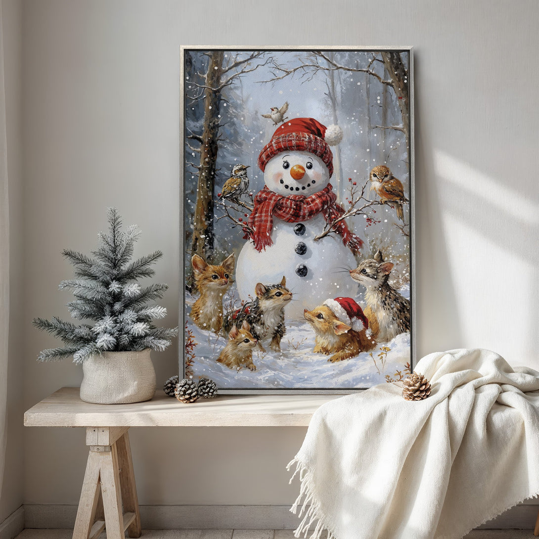 Framed Wall Art featuring a whimsical winter scene with a snowman, animals, and birds in a snowy forest. Warm red and cool blue tones.